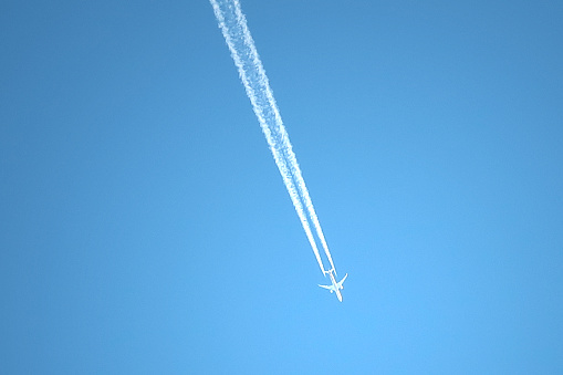 Blue Clear Sky And Airplane With Contrail