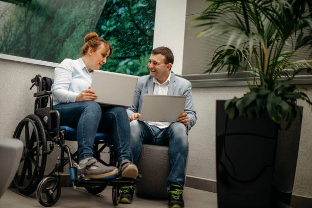 istock Working in wheelchair 1369705628