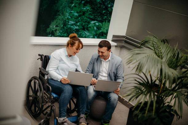 istock Working in wheelchair 1369705629