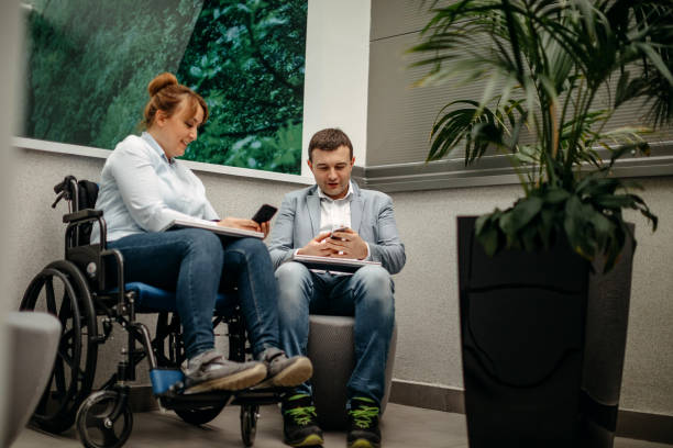istock Working in wheelchair 1369705798