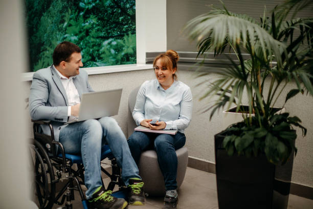 istock Working in wheelchair 1369705853