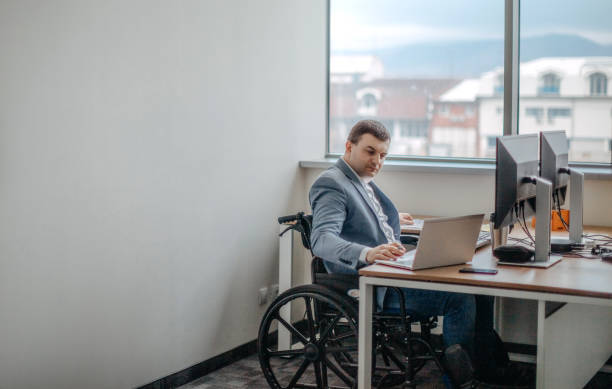 istock Working in wheelchair 1369707293