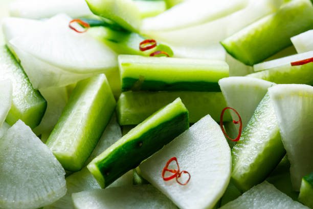 istock Cut cucumbers and radishes 1369710920