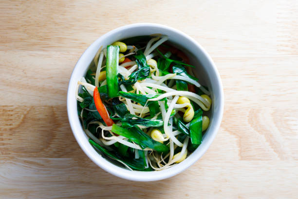 A collection of Japanese vegetables cut up for cooking and various recipes.