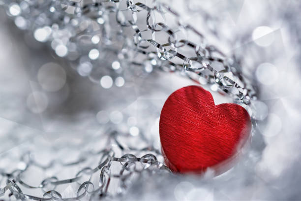 Transparent statuettes of small angels with hearts in their hands.