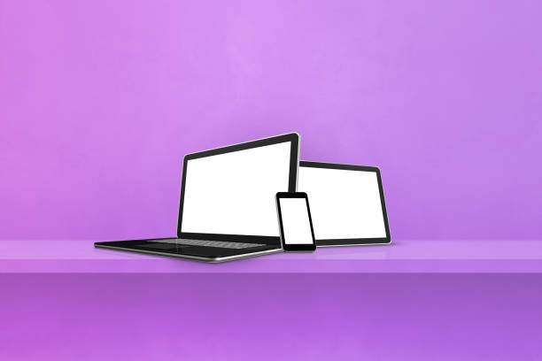 istock Laptop, mobile phone and digital tablet pc on purple wall shelf. Horizontal background 1369716581