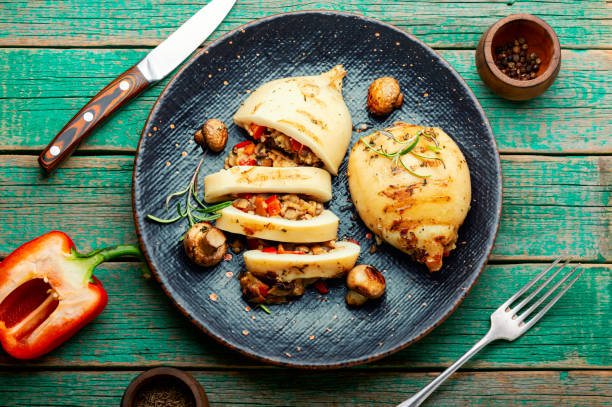 Grilled squid with mushroom stuffing Grilled squid stuffed with mushrooms and bell pepper. Seafood, asian food calamari stock pictures, royalty-free photos & images