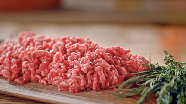 istock Raw minced meat on a wooden surface. 1369719858