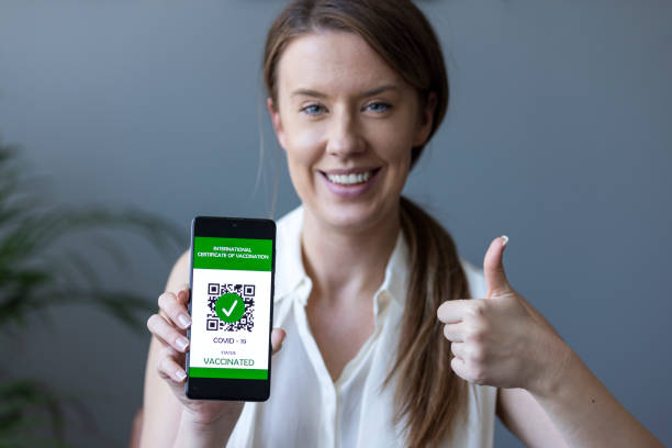 istock Green pass certificate of vaccination on smartphone 1369720624