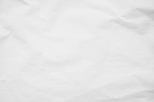 istock White recycled craft paper background. Abstract grey material texture old vintage page, grunge vignette of newspaper sheet. Pattern rough parchment crease grunge letter with copy space for text. 1369720925