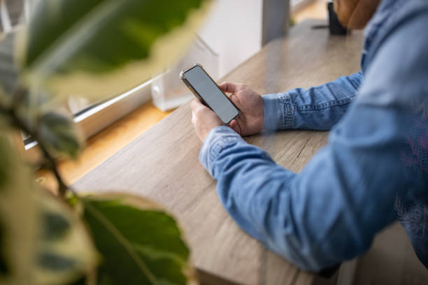 istock Unrecognizable man ordering food via mobile app 1369721460