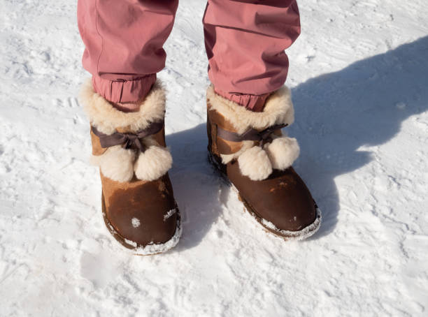 Little Girl Standing on Snowfield