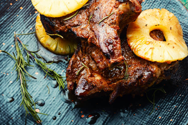 Meat barbecue with pineapple rings.