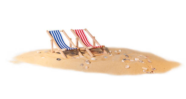 istock Isolated sand with seashells and sun loungers on a white background 1369725394
