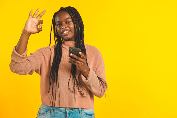 istock Happy teenager doing ok sign 1369726310