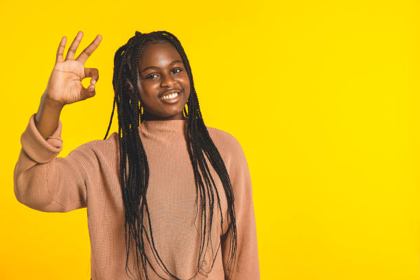 istock Happy teenager doing ok sign 1369726362