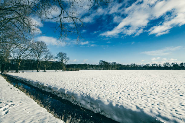 Snowy winter landscape during a beautiful winter day around the Windesheim estate in Overijssel, Netherlands.
