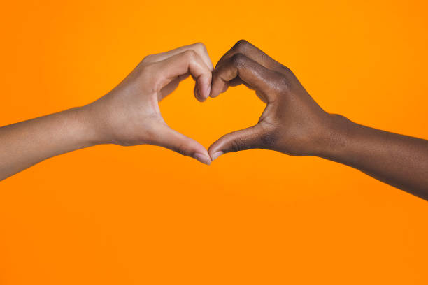istock Diverse hands with love sign 1369729179