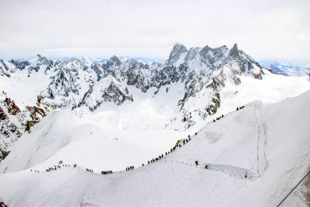 istock Ski lovers walking on ski trails in Plan de L'Aiguille 1369730889