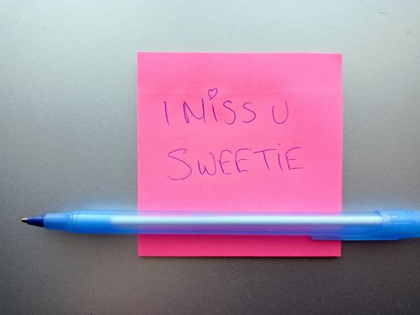 istock Pink post it note with a love message written in blue pen Love at work and in the office love at first sight and secret message 1369732549