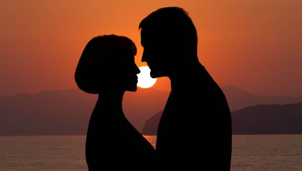 istock Couple in love at sunset 1369734744