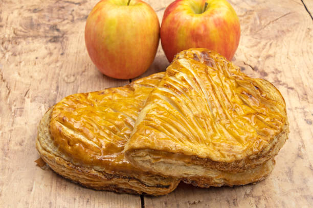 apple turnovers with apples apple turnovers with apples on a wooden donut apple strudel stock pictures, royalty-free photos & images