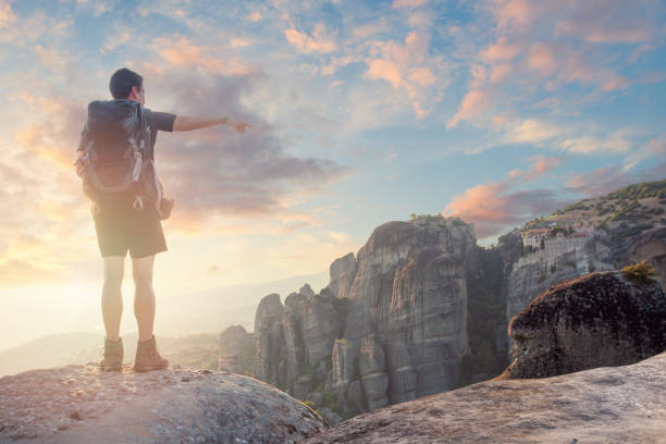 istock Man traveller enjoying nature on the mountains 1369735822