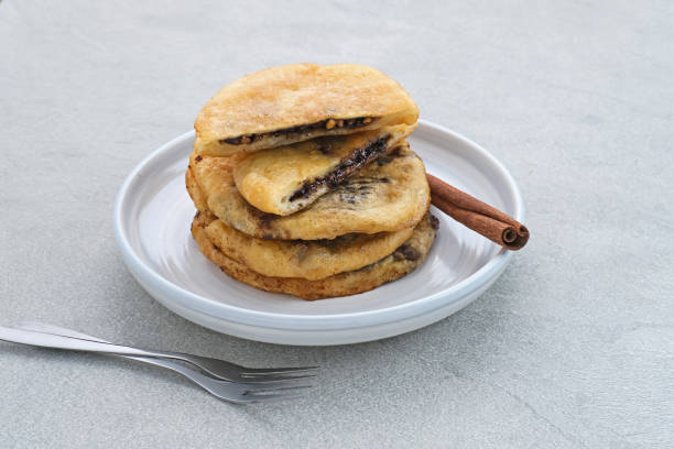 Hotteok, South Korean pancakes or fried dough with nuts and sugar filling.