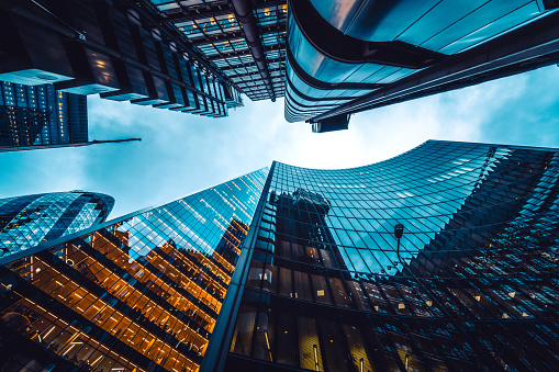 Looking directly up at the skyline of the financial district in central London