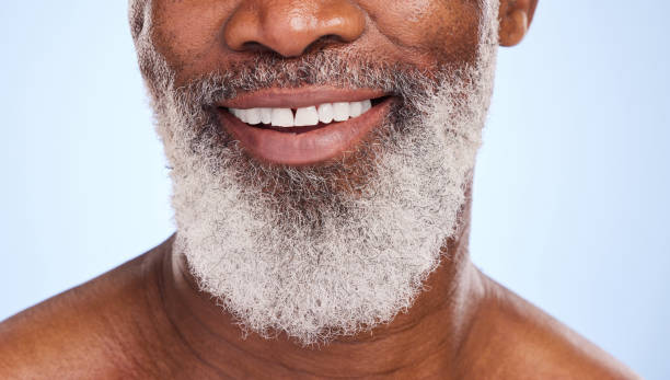 istock Cropped shot of a mature man smiling while posing against a blue background 1369738719