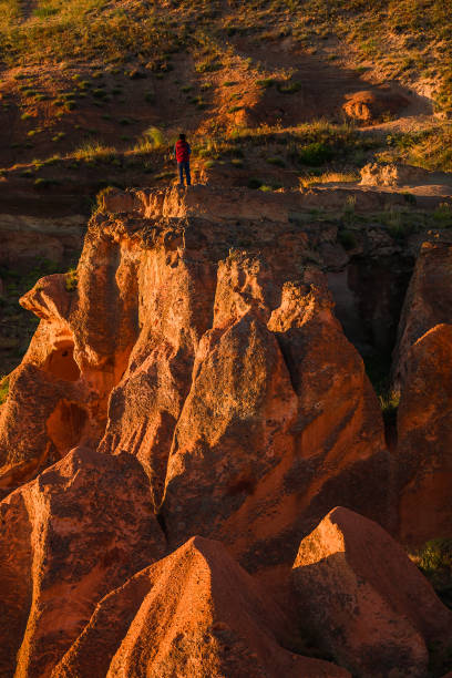 istock Rock Formation and Sunlight with unrecognizable person in Cappadocia 1369740256