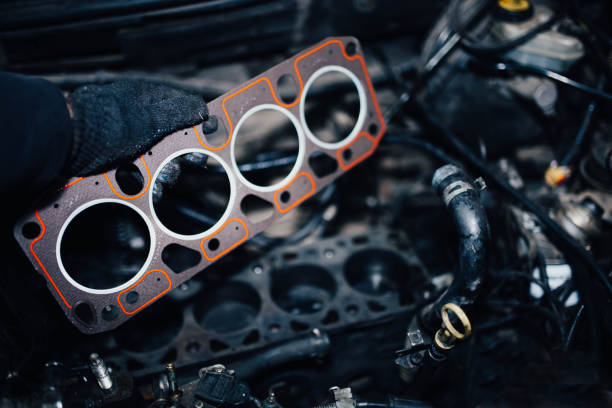 replacement of the cylinder head gasket in the car engine. stock photo