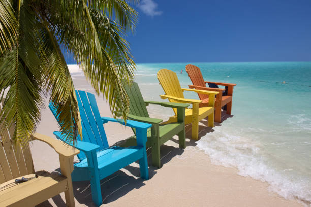 istock Colorful beach chairs on caribbean coast 1369741510