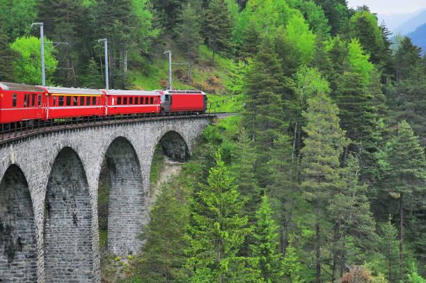 istock Passenger train goes from Chur to St. Moritz. 1369746424