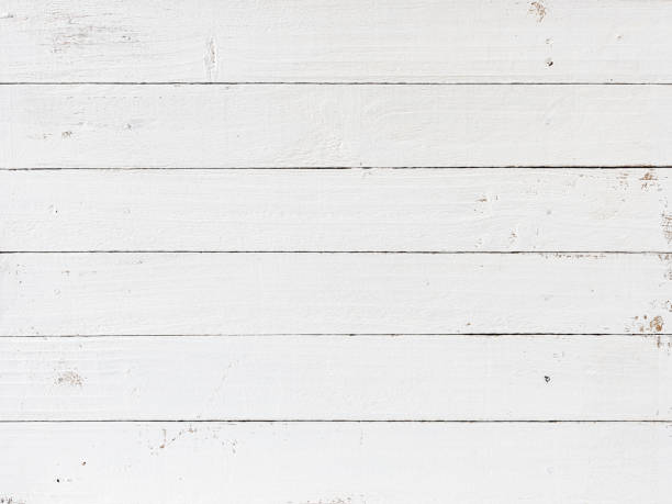 istock Old weathered abstract white-colored wood-paneled background. 1369747567