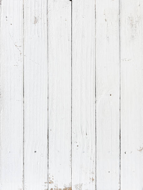 istock Old weathered abstract white-colored wood-paneled background. 1369747568