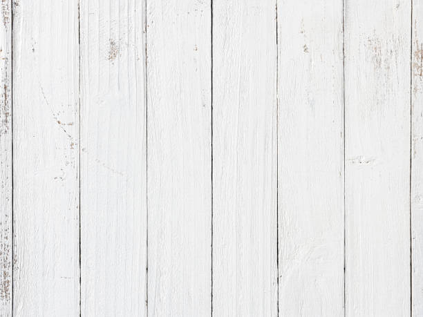 istock Old weathered abstract white-colored wood-paneled background. 1369747604