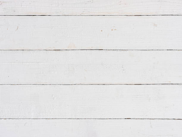 istock Old weathered abstract white-colored wood-paneled background. 1369747653