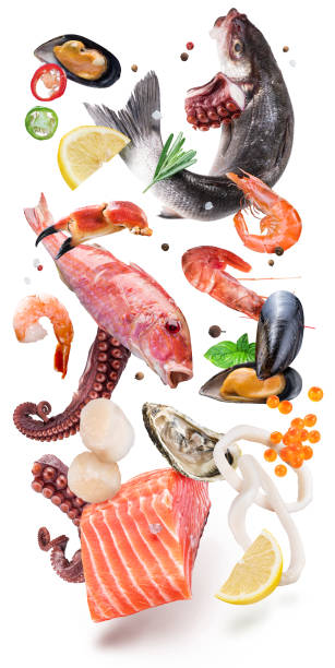 istock Fresh seafood, fish and seasonings levitating on white background. File contains clipping path. 1369747746