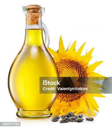 istock Bottle of sunflower oil, sunflower and seeds isolated on white background. The most popular of vegetable oils. 1369747765