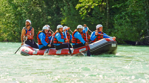 istock Rrafters paddling their raft in the river 1369748085