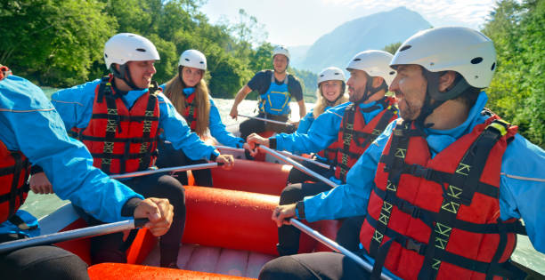 istock Rrafters paddling their raft in the river 1369748091