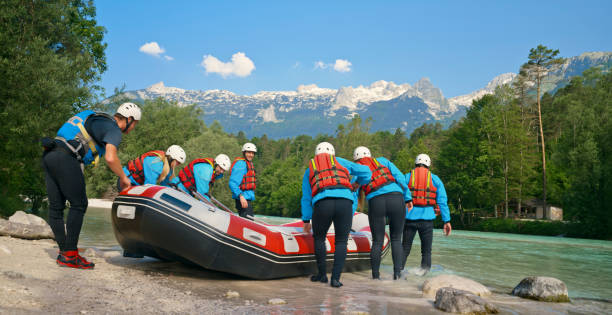 istock Rafting team pushing the raft into the river 1369748100
