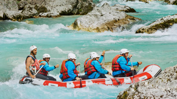 istock Whitewater rafters rowing their raft in the river 1369748102
