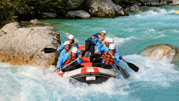istock Whitewater rafters rowing their raft in the river 1369748117