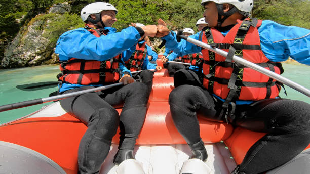 istock Rrafters paddling their raft in the river 1369748123