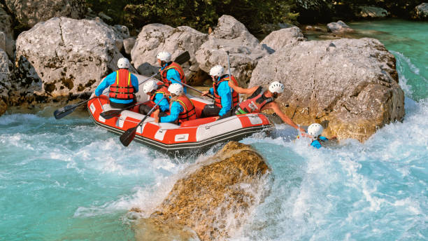 istock Whitewater rafters rowing their raft in the river 1369748135