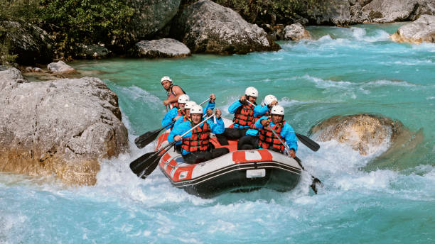 istock Whitewater rafters rowing their raft in the river 1369748142
