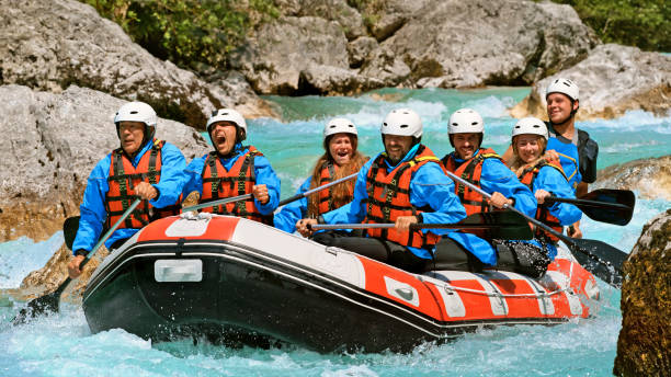 istock Whitewater rafters rowing their raft in the river 1369748186