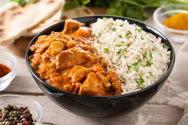 istock Indian butter chicken in black bowl 1369748546